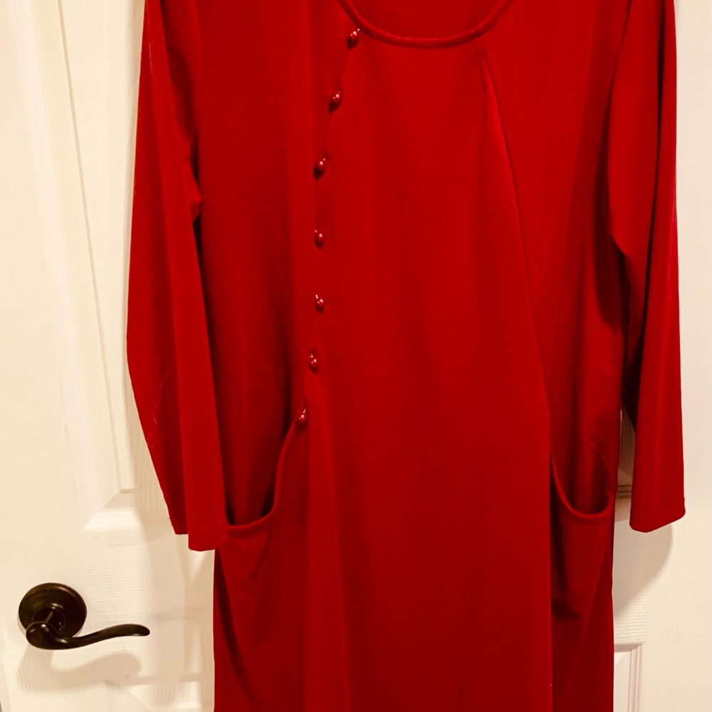 Comfortable pocketed red sheath! Rounded neckline works well with jacket/scarves